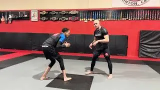 Arm drag, leg trap to takedown 