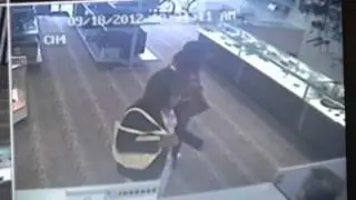 Armed cross-dressing men rob pawn shop.