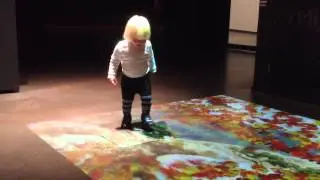 Child playing with interactive floor game, Maritime Centre Vellamo, Kotka