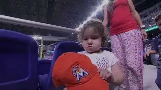 BAL@MIA: Young Marlins fan does not want to wear hat