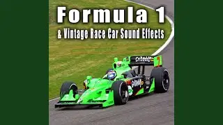 Vintage Formula 1 Car Passes by Slowly from Left to Right