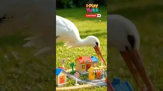a stork playing with toys🚉🚊🦩 #play #animals #birds #stork #train #toys #ai