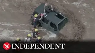 Family rescued from car roof during rapid-moving flood in Arizona