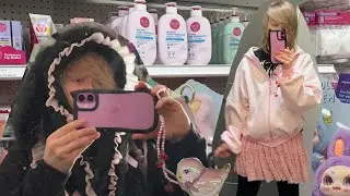 Emo tries on pink clothes at Target