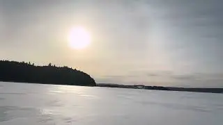 Riding on frozen Saint John River, Sunset with Luna guiding the trip