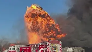 Commercial building with &lsquo;flames through the roof&rsquo; sparked brush fire