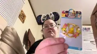 a pin and funko and some cards