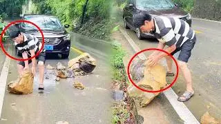 A kind driver moved a large rock blocking the road to the side, benefiting all drivers.#funny