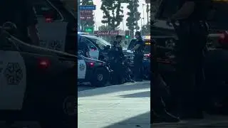 Suspect detained on curb after fight with officers in Pomona