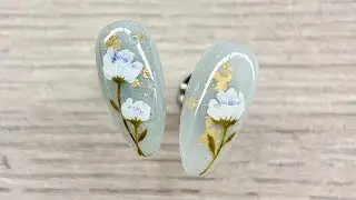 Elegant Hand-Painted Floral Nail Design | Subtle Light Blue & Gold Accent