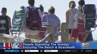 Tri-State Area Residents Enjoying Holiday Weekend At The Beach