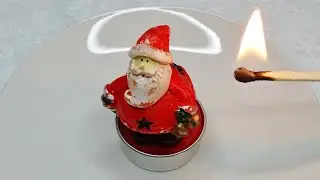 Burning a Santa Claus Christmas Candle &ndash; Satisfying Tealight Time Lapse Video