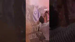 Anti-government demonstrators gather outside the residence of Israeli minister Benny Gantz