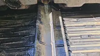 EcoFlo Peat Moss tipping tray septic tank effluent filter cleaning with flow into treatment tank.
