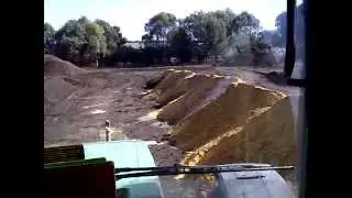Blending minerals with our finished compost using the compost turner