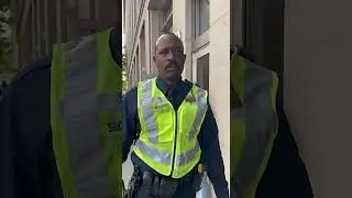 Un agent de s&eacute;curit&eacute; tente d'emp&ecirc;cher le tournage, mais se fait arr&ecirc;ter par la loi.