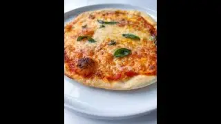 Mom of two making homemade pizzas