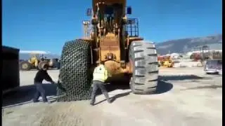 Fitting chains On Caterpillar 992 Wheel Loader By Themis Kalaitzidis