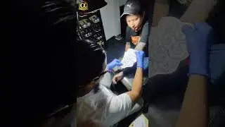 White ink tattoo on blackout skin