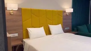 Номер Deluxe в стильном парк-отеле Sun Village Arkhyz в горах Архыза с тёплым бассейном и рестораном