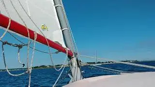 Herreshoff America catboat cross paths with the futuristic Eagle
