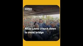 Atlas Lions crouch down to avoid a low bridge