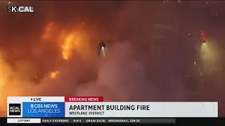 Firefighters amid blaze burning through Westlake apartment complex