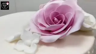 sharp edge cake with roses on top
