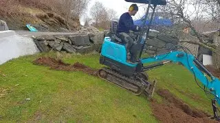 Digging as steep as possible with the 1-ton mini - doing a french drain rehab