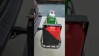 Hitch mounted cargo carrier with gas can holder