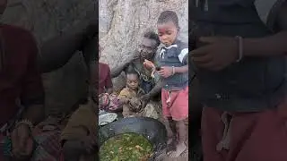 Traditional Hadzabe tribe cooking wild meat in Tanzania.Village food and African culture lifestyle.