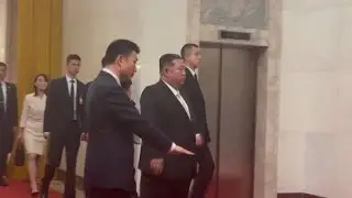 Kim Jong Un arrives at the Great Hall of the People for talks with Xi