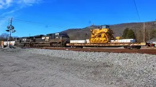 Norfolk Southern 123 with 2 cat dozers in tow thru Emory Gap yard. in Harriman Tennessee 