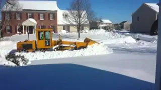 Grader tires about my shoulder height.
