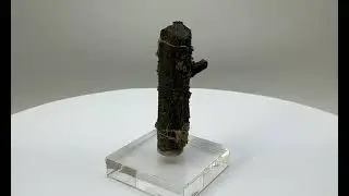 Cluster of etched Ilvaite crystals with a prominent double-terminated crystal    1