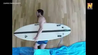 Surfer 'rides waves' inside apartment in stop motion video