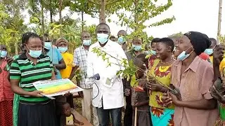 Giving out seedlings on a medical outreach in manafwa district Uganda Africa