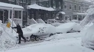 Blizzard warnings and travel shutdowns trap millions at home in northeastern US