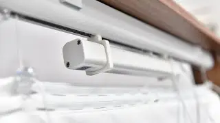Where is a Motorised Roman Blind Battery Installed?