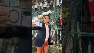 Former Pakistan Women's captain Sana Mir poses with children at the ground