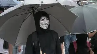 Soaked Hong Kong Protesters Again Defy Mask Ban In Huge Rally