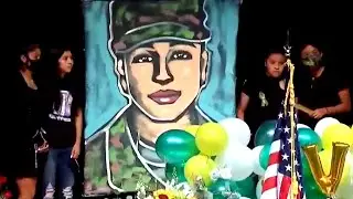 Vanessa Guillen Memorial: Ange Hillz paints a portrait of Vanessa Guillen during a memorial service
