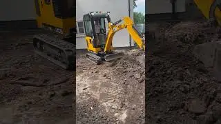 Mini Digger Digging Out For New Patio