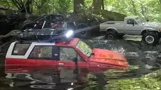 A Diverse Group Of RC Crawlers on a Rough Trail Run
