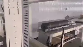 Six-sided packaging of panels and boards by automatic bagging machine