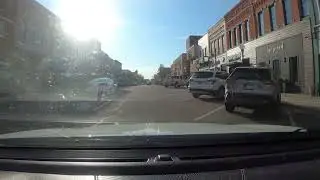 Downtown Chaos: Driver Tries to Merge Into My Lane for a Parking Spot!