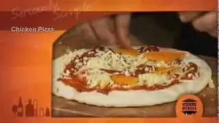 Piero's Pizza base with roast chicken, pumpkin cashews and Rogan Josh sauce