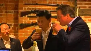 David Cameron treats President Xi to fish and chips over a pint at his local pub