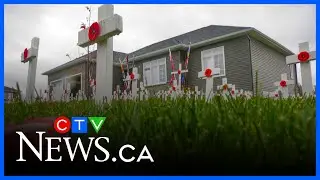 Vet honours friends in front yard memorial