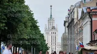 Moscow Kudrinskaya Square Building dominating street view with people passing
